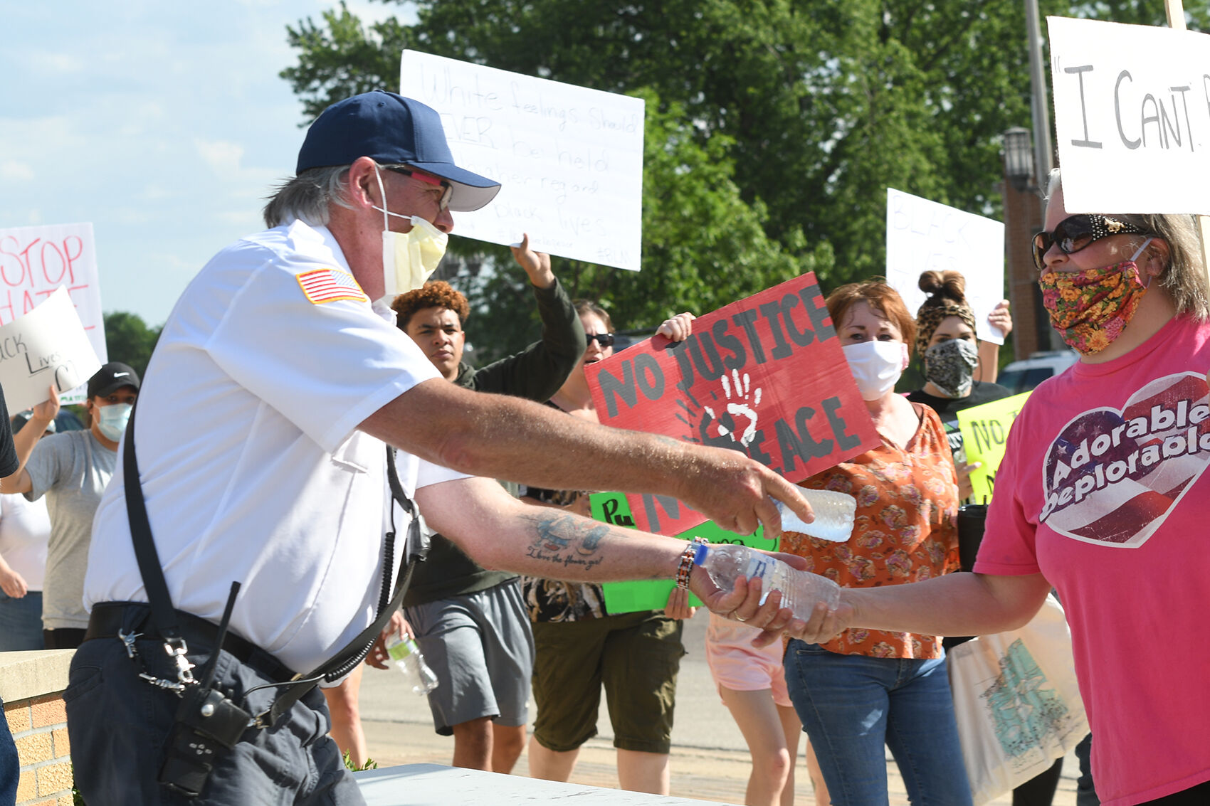 John Conyn gives water at Spencer march